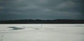 Woman Walking on Frozen Lake