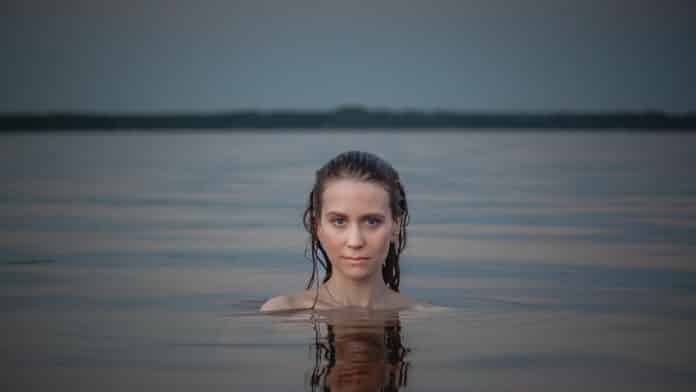 Lisah Silfwer taking a dip in Lake Siljan, Dalarna County.